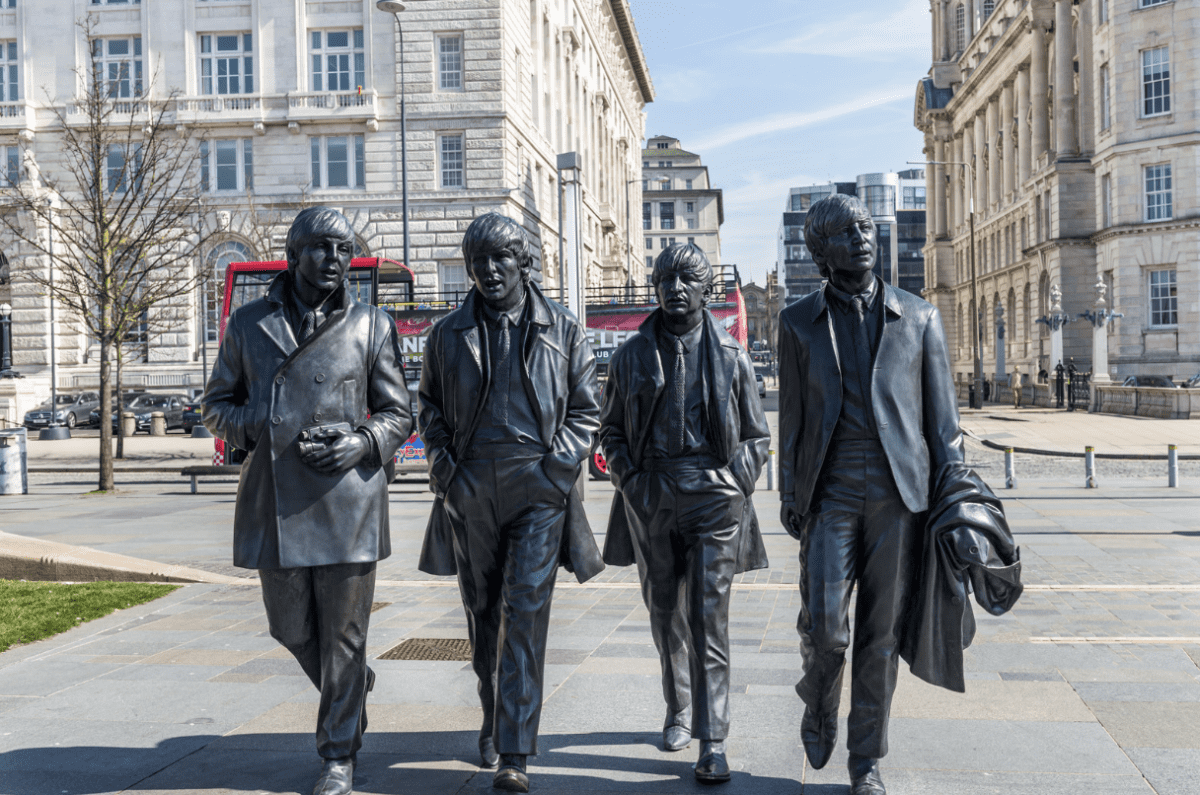 Famous statues of The Beatles in Liverpool city centre on a sunny day