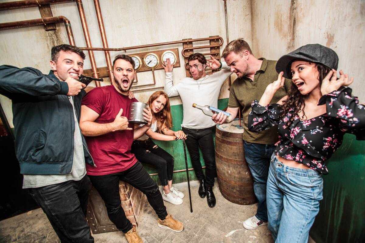 group playing escape room for summer activities