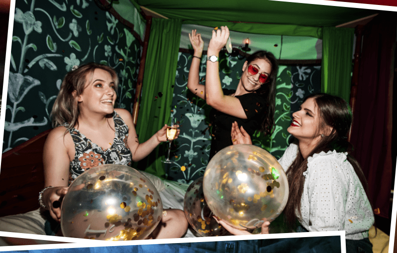 group of women in an escape room celebrating